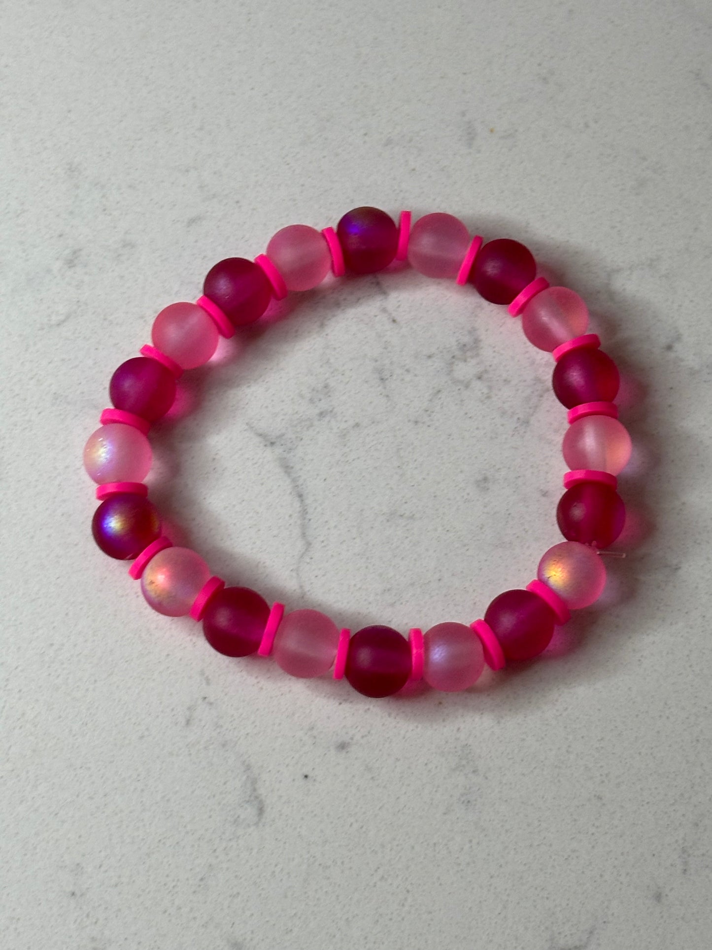 Pink , pink , and more pink glass beaded bracelet