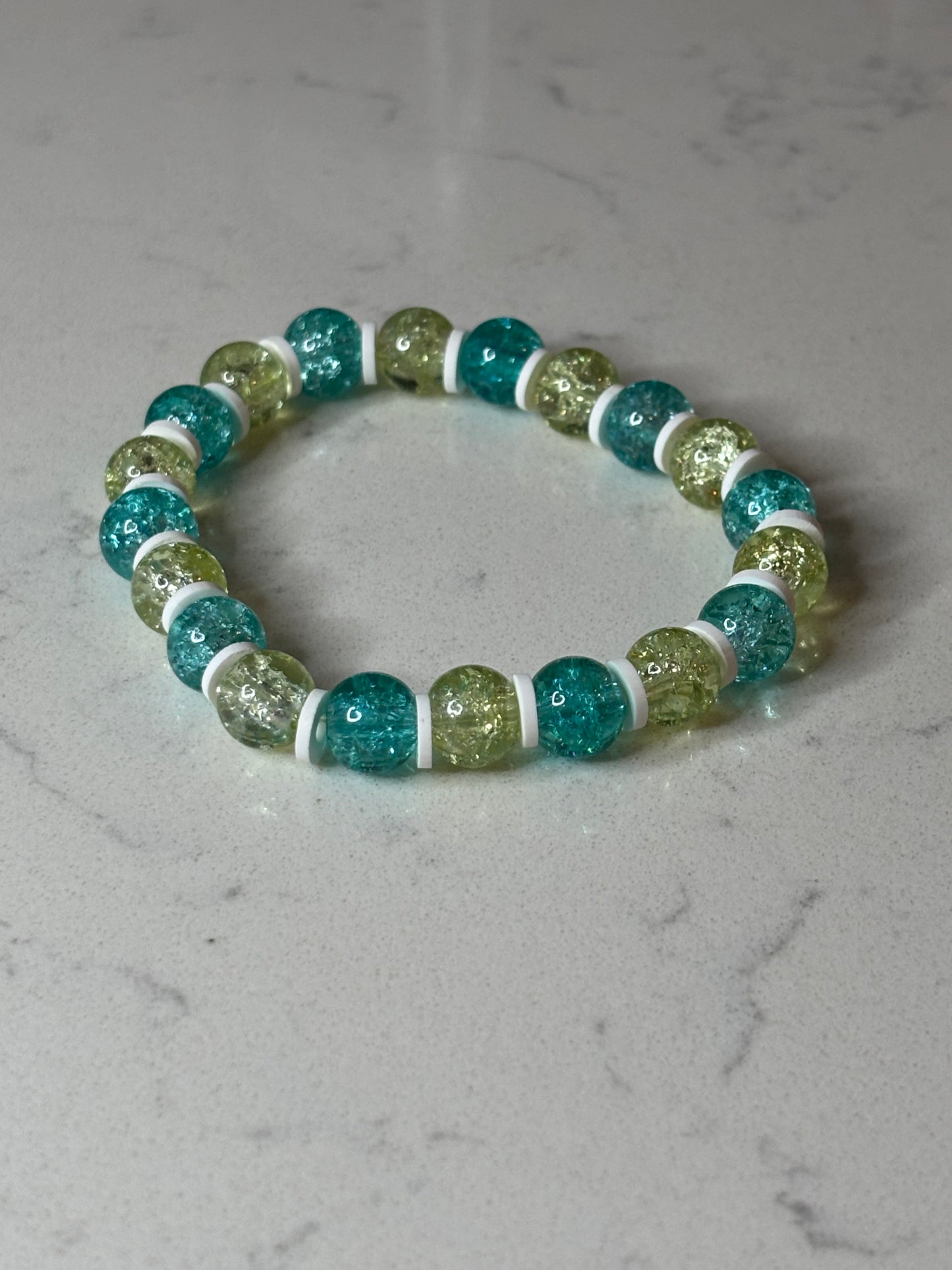 Blue and yellow and white glass and clay beaded bracelet