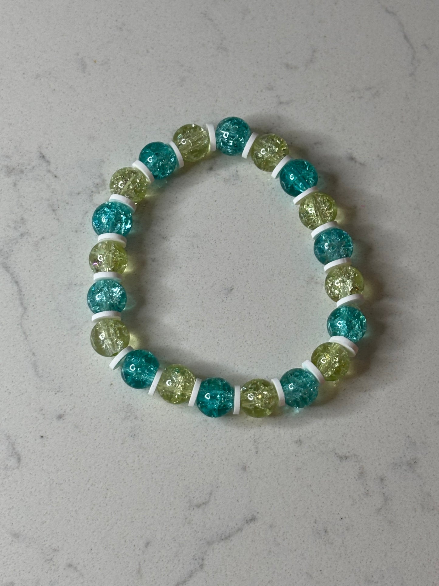 Blue and yellow and white glass and clay beaded bracelet