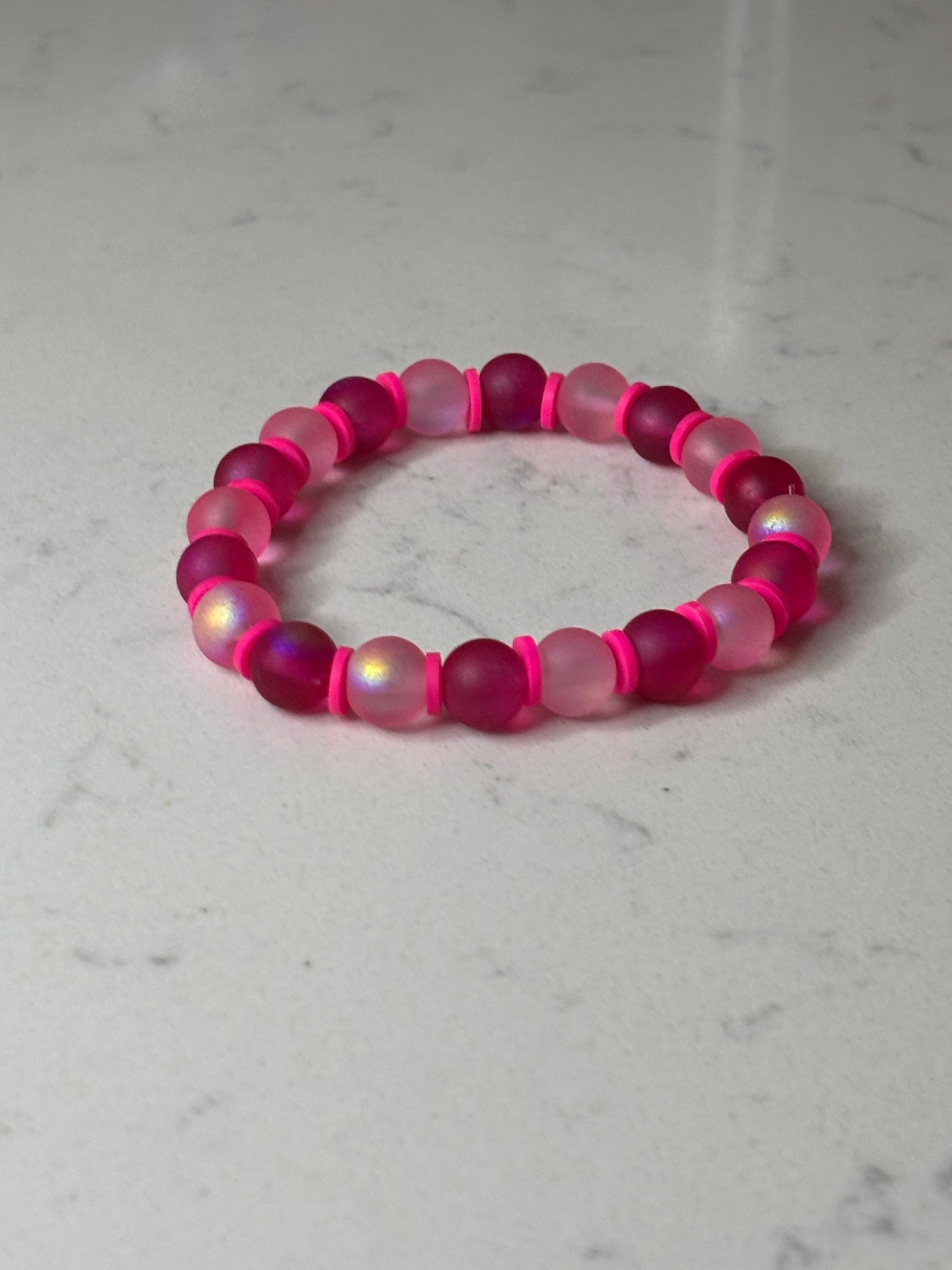 Pink , pink , and more pink glass beaded bracelet